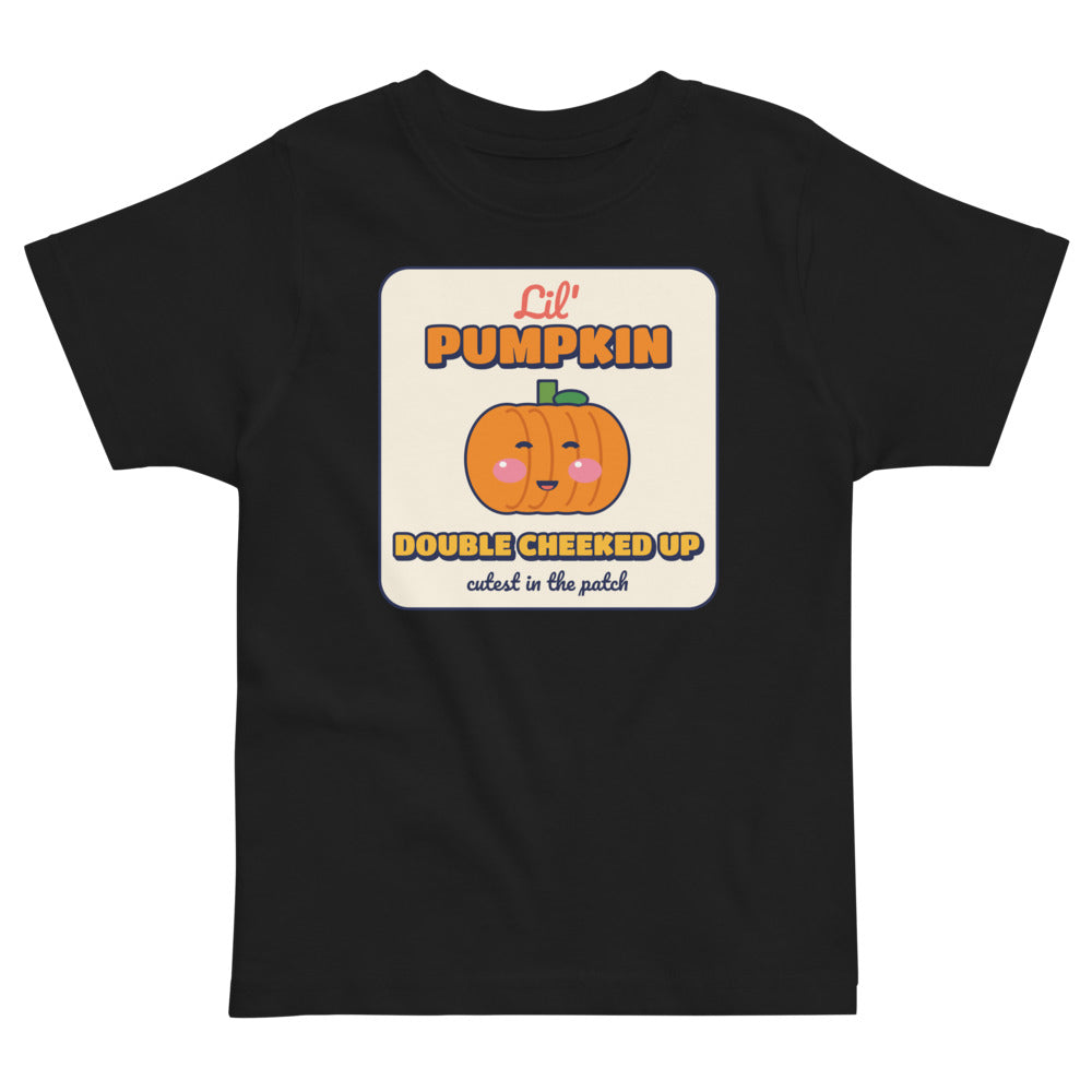 Double Cheeked Up Lil' Pumpkin Toddler Tee in black, mockup of the design printed on the front of the toddler tee