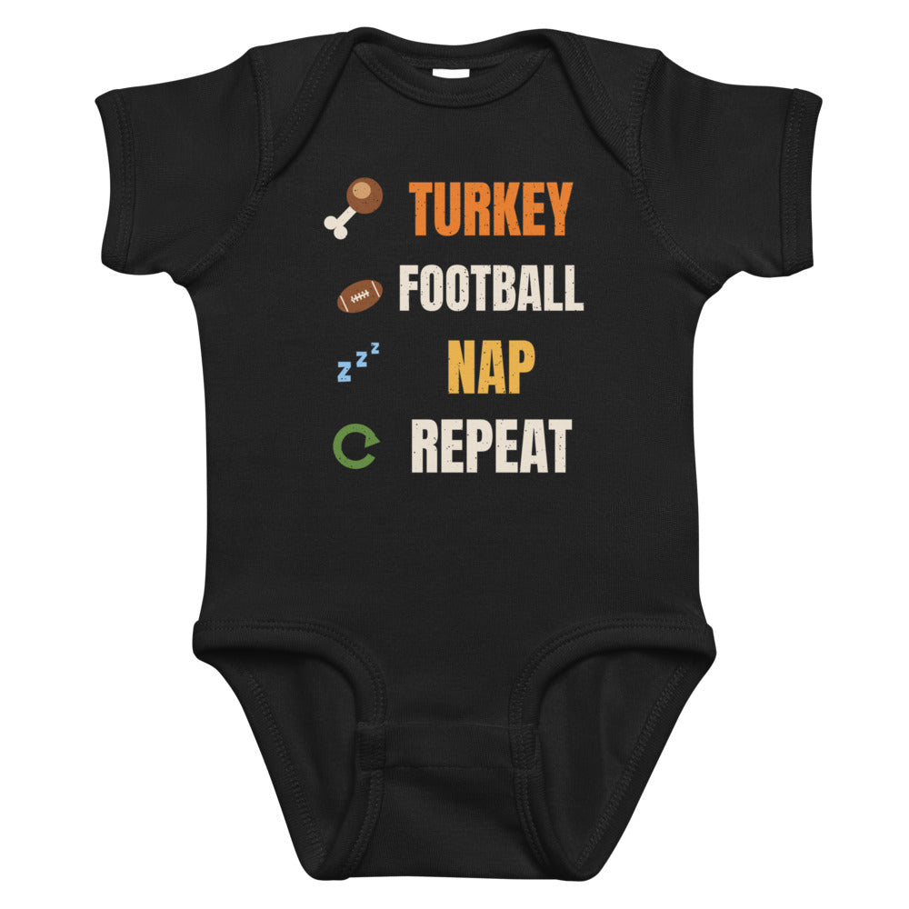 Turkey Football Nap Repeat Baby Onesie in black, mockup of the design printed on the front of the baby onesie