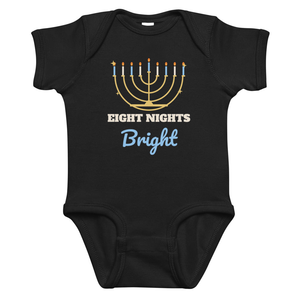 Eight Nights Bright Baby Onesie in black, mockup of the design printed on the front of the baby onesie
