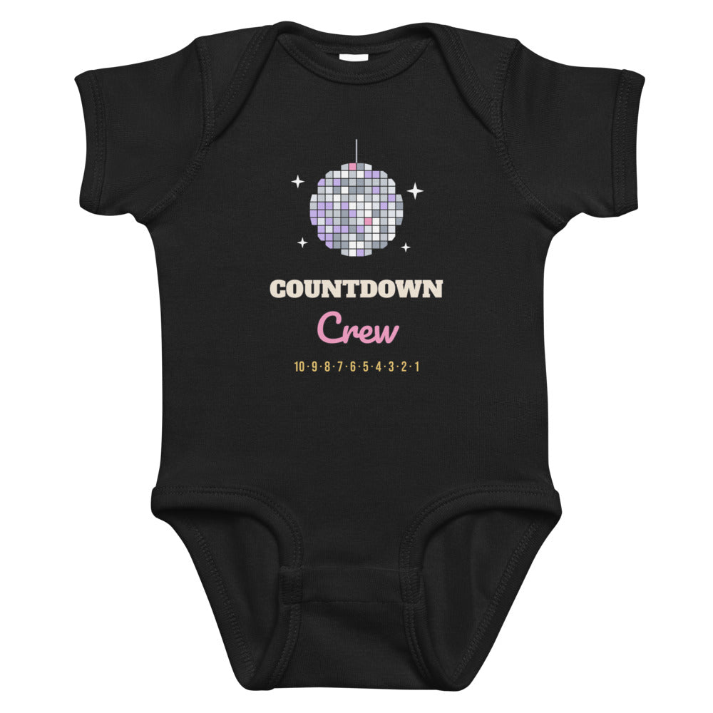 Countdown Crew Baby Onesie in black, mockup of the design printed on the front of the baby onesie