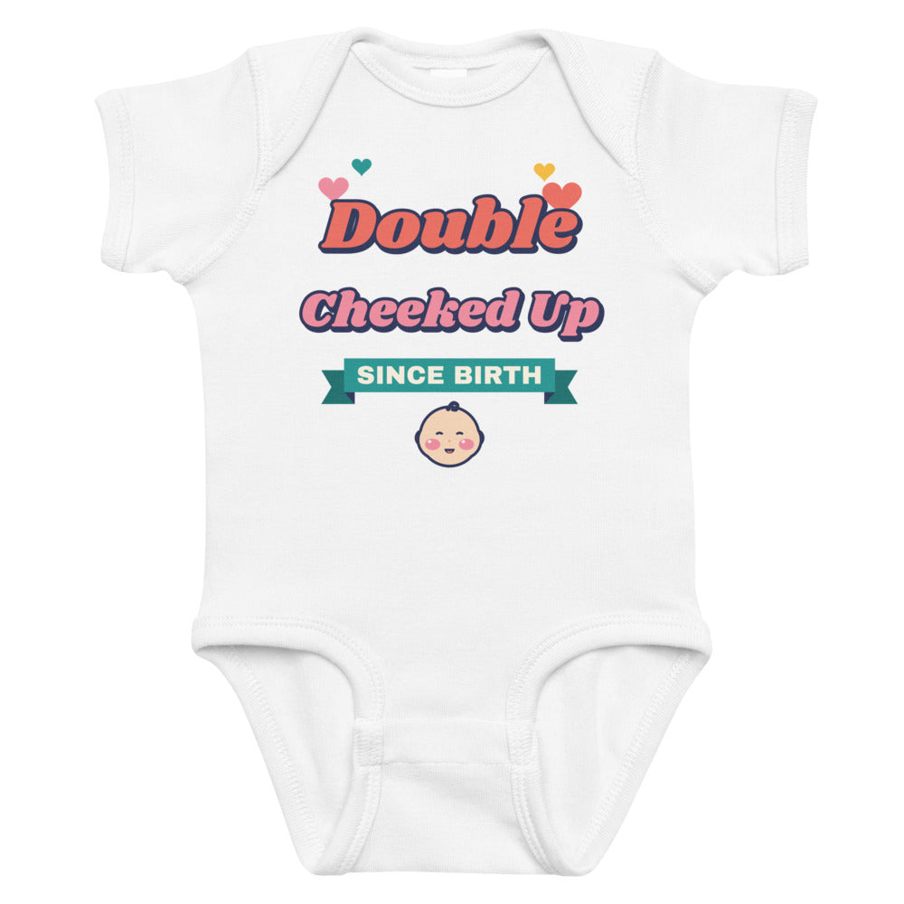 Double Cheeked Up Since Birth Baby Onesie in white, mockup of the design printed on the front of the baby onesie