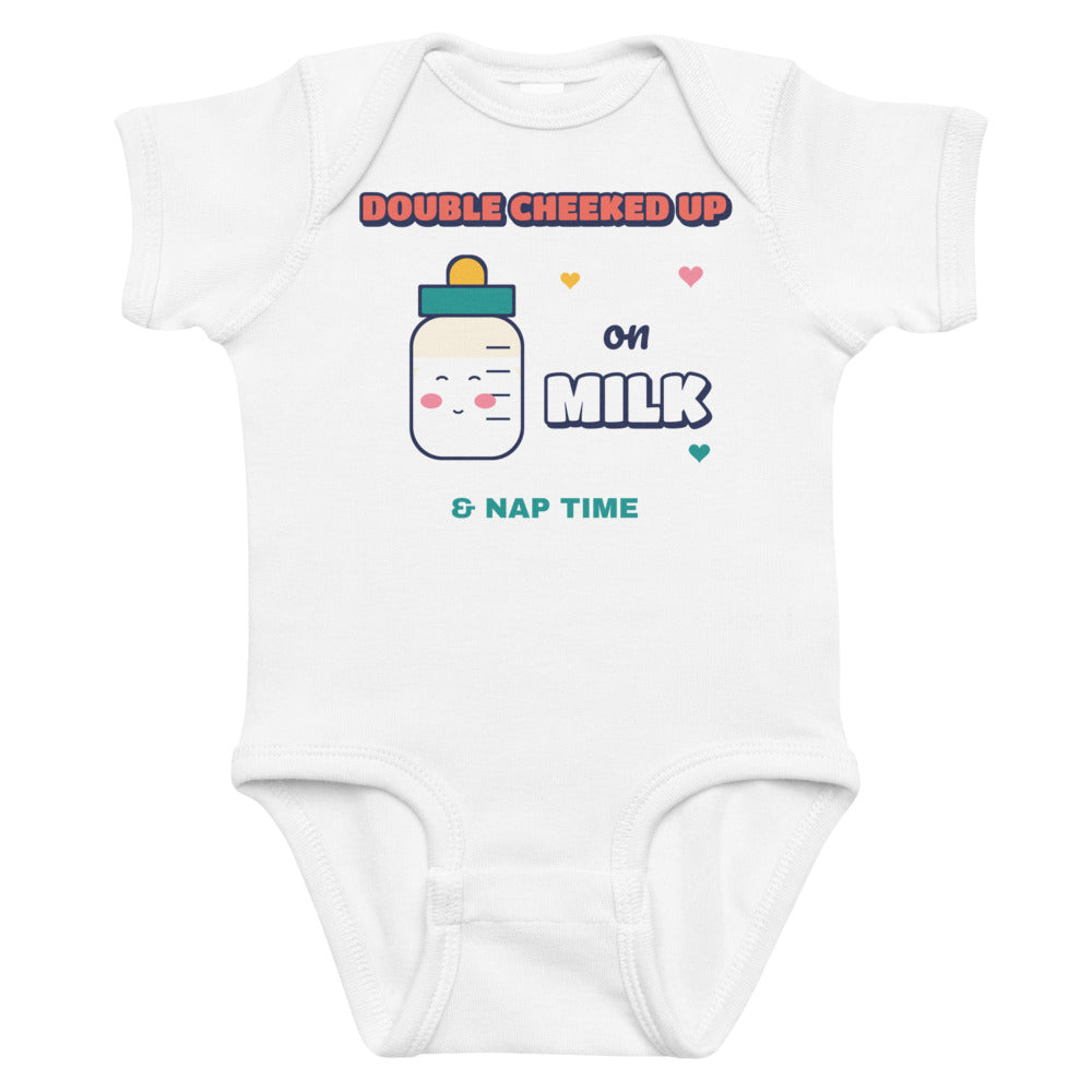 Double Cheeked Up on Milk Baby Onesie in white, mockup of the design printed on the front of the baby onesie