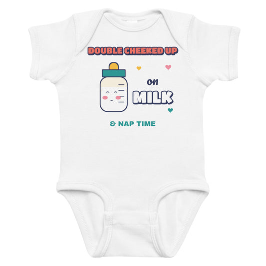 Double Cheeked Up on Milk Baby Onesie in white, mockup of the design printed on the front of the baby onesie