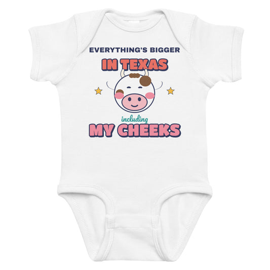 Everything's Bigger in Texas Including My Cheeks Baby Onesie in white, mockup of the design printed on the front of the baby onesie