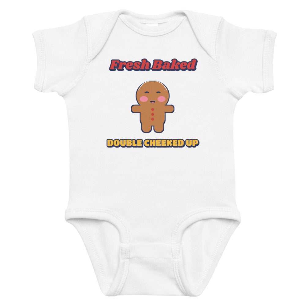 Double Cheeked Up Fresh Baked Gingerbread Baby Onesie in white, mockup of the design printed on the front of the baby onesie