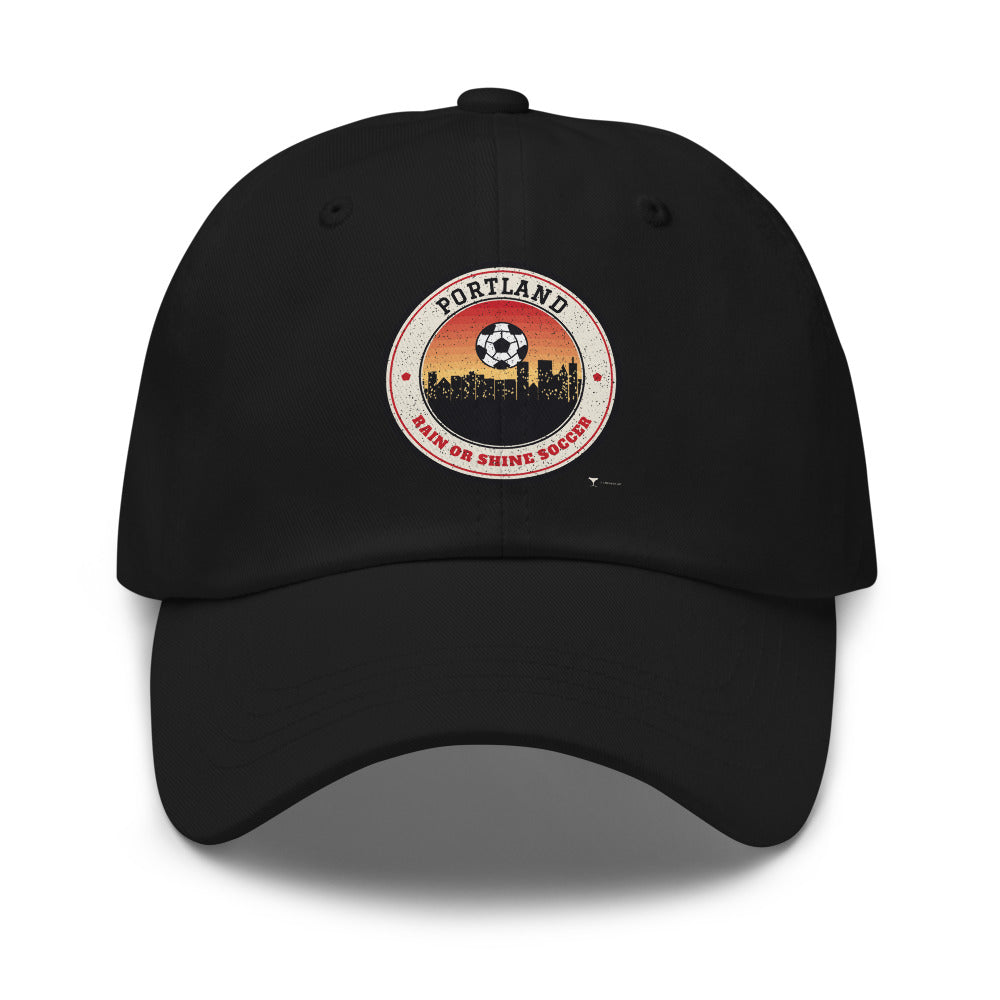 Portland Rain or Shine Soccer Dad Hat in black, design printed on the front panel, front view