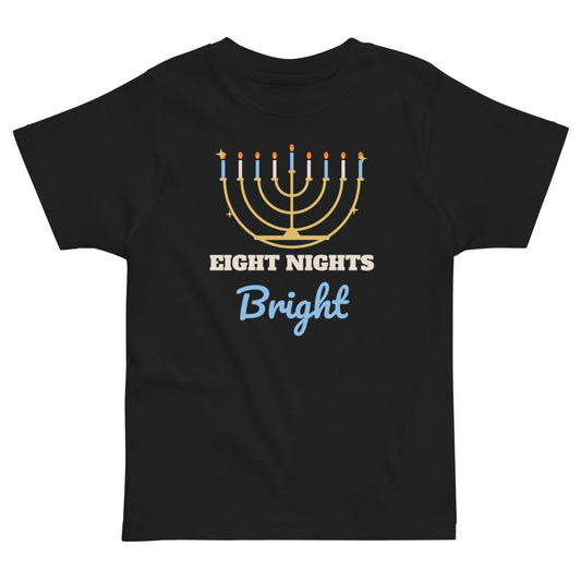 Eight Nights Bright Toddler Tee in black, mockup of the design printed on the front of the toddler tee