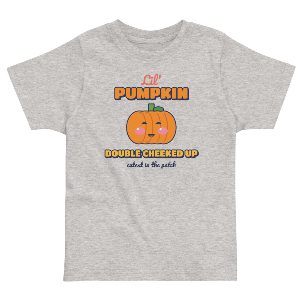 Double Cheeked Up Lil' Pumpkin Toddler Tee in heather, mockup of the design printed on the front of the toddler tee