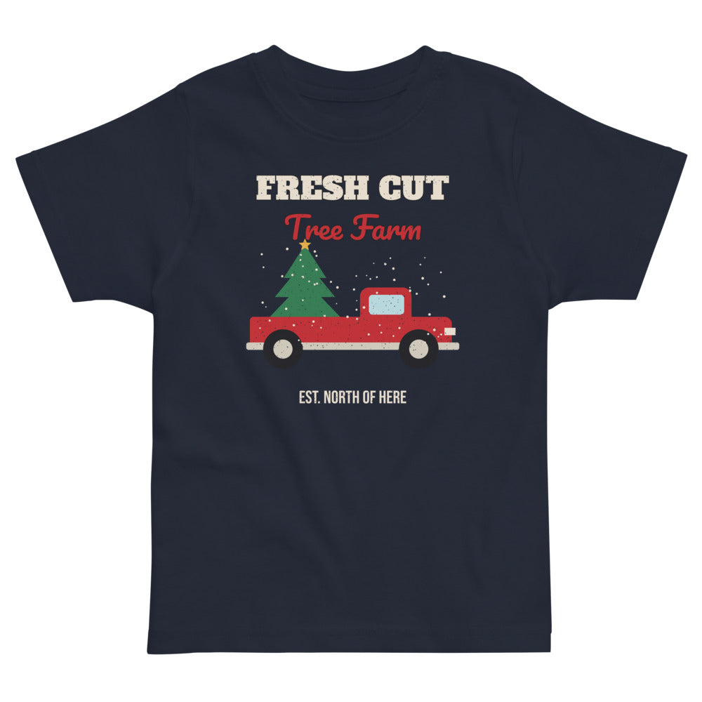 Fresh Cut Tree Farm Toddler Tee in navy, mockup of the design printed on the front of the toddler tee