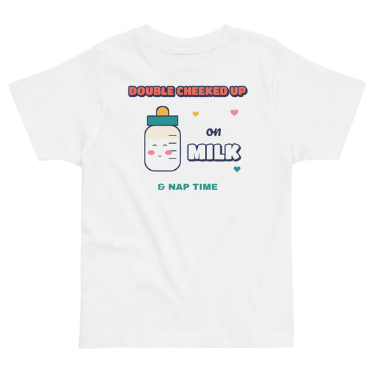 Double Cheeked Up on Milk Toddler Tee in white, mockup of the design printed on the front of the toddler tee