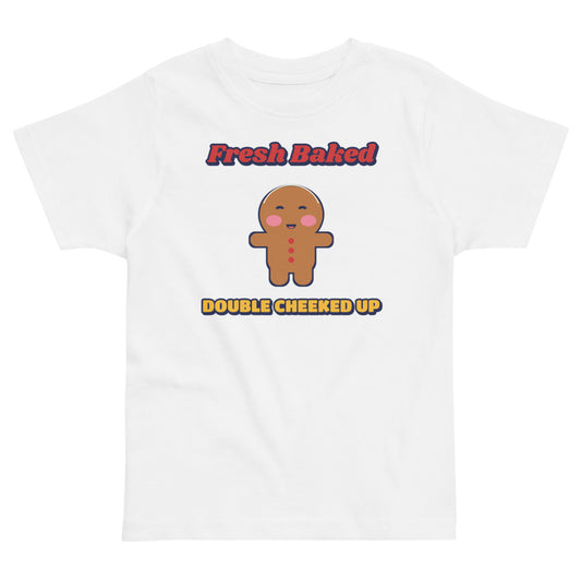Double Cheeked Up Fresh Baked Gingerbread Toddler Tee in white, mockup of the design printed on the front of the toddler tee