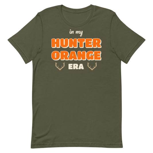 In My Hunter Orange Era Unisex Tee in military green, design printed on the front, front view