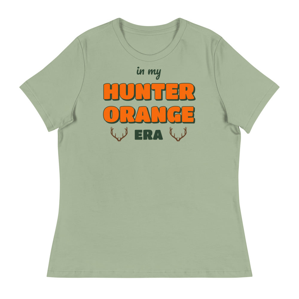 Women's In My Hunter Orange Era Relaxed Tee in sage, design printed on the front, front view