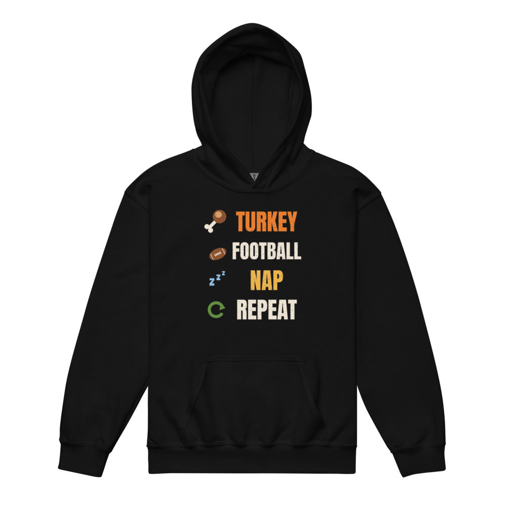 Turkey Football Nap Repeat Kids Hoodie in black, mockup of the design printed on the front of the kids hoodie