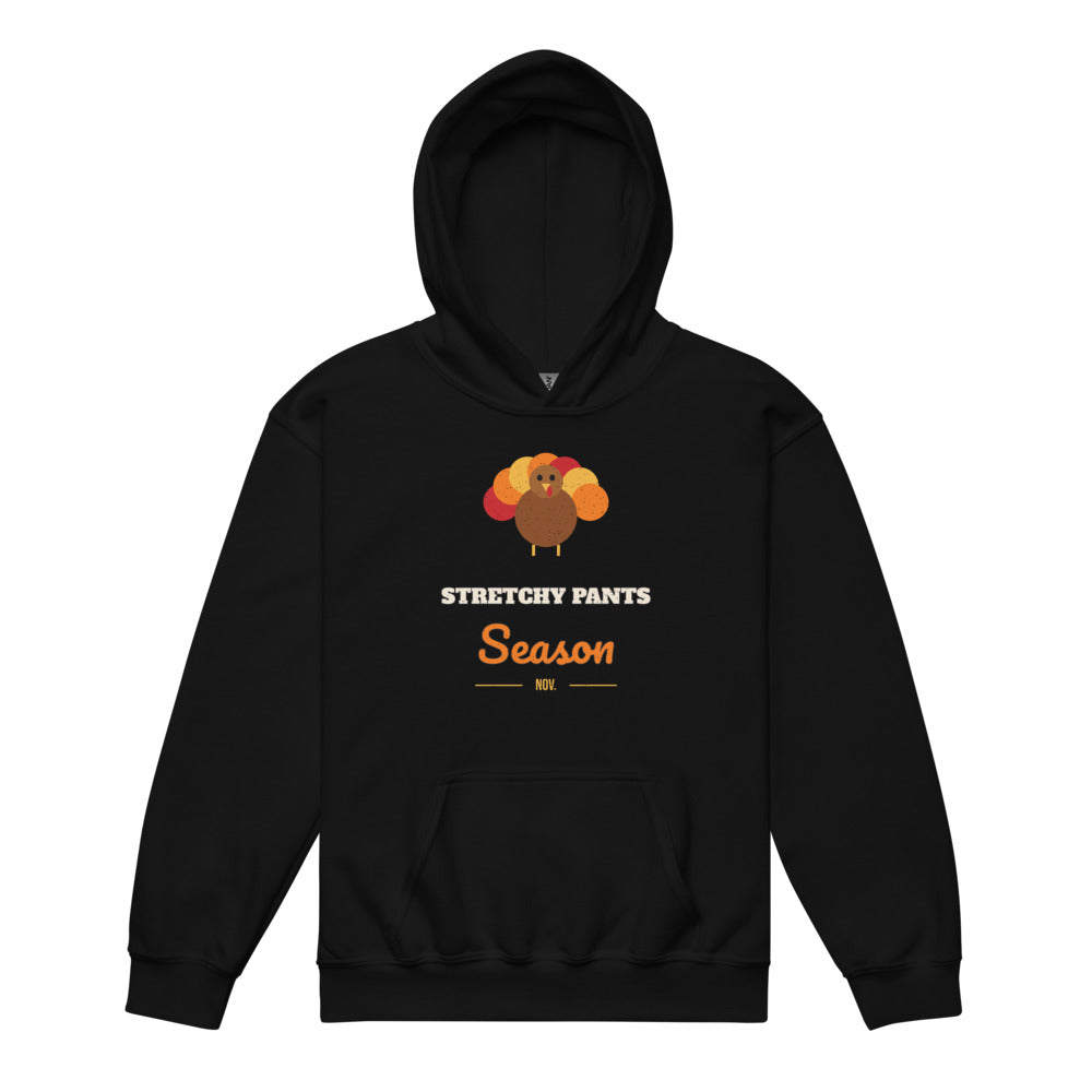 Stretchy Pants Season Kids Hoodie in black, mockup of the design printed on the front of the kids hoodie