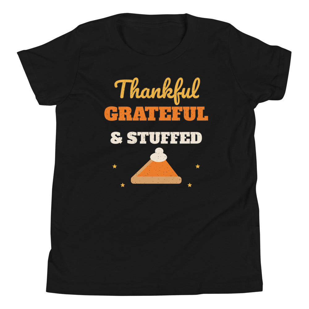 Thankful, Grateful & Stuffed Kids Tee in black, mockup of the design printed on the front of the kids tee