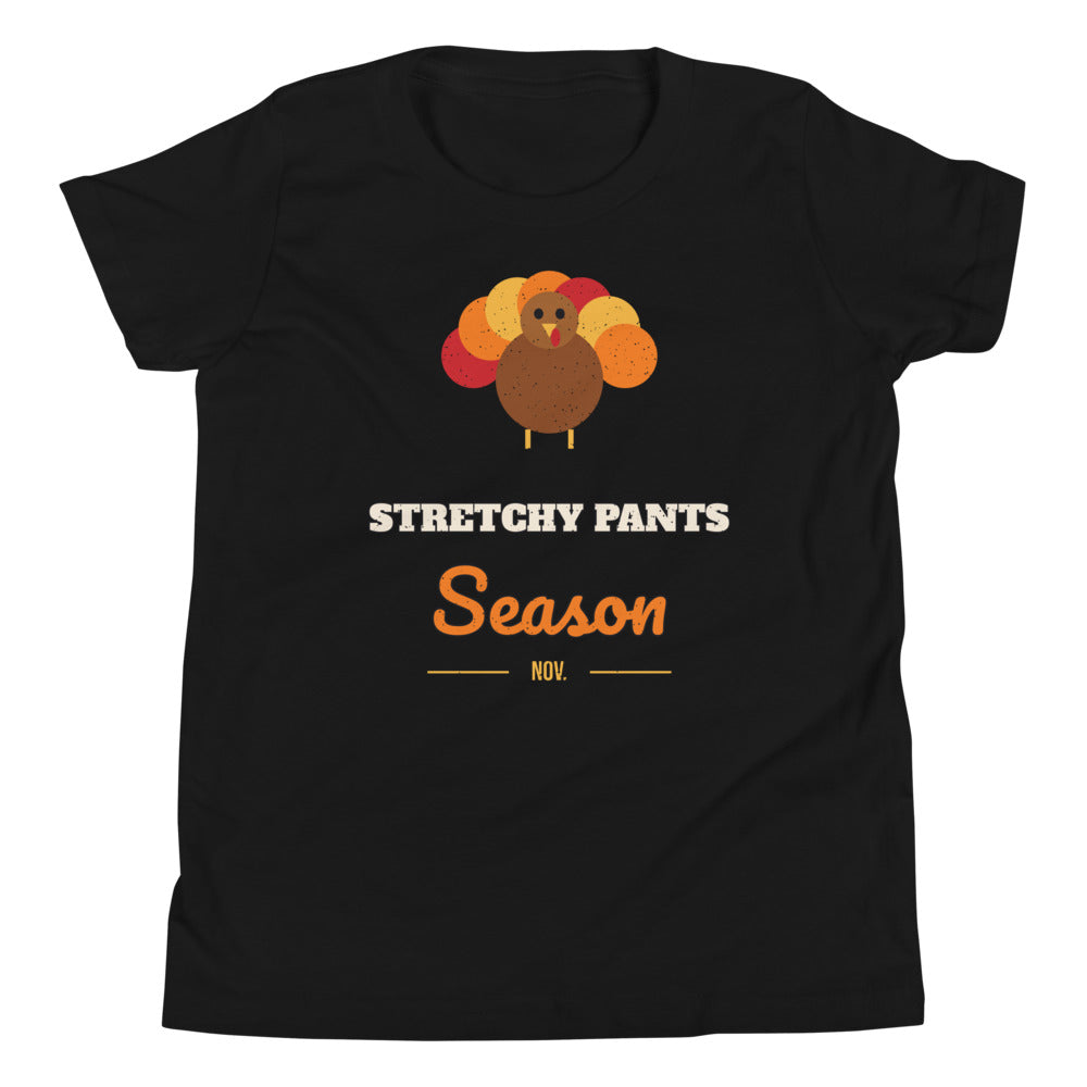 Stretchy Pants Season Kids Tee in black, mockup of the design printed on the front of the kids tee